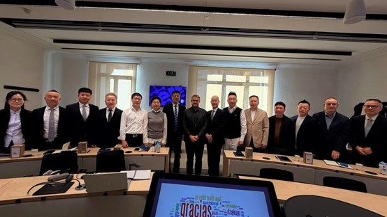 The delegation took a group photo with faculty members at IE Business School